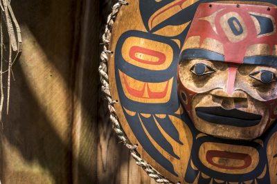 Close up of a painted Native American totem face.