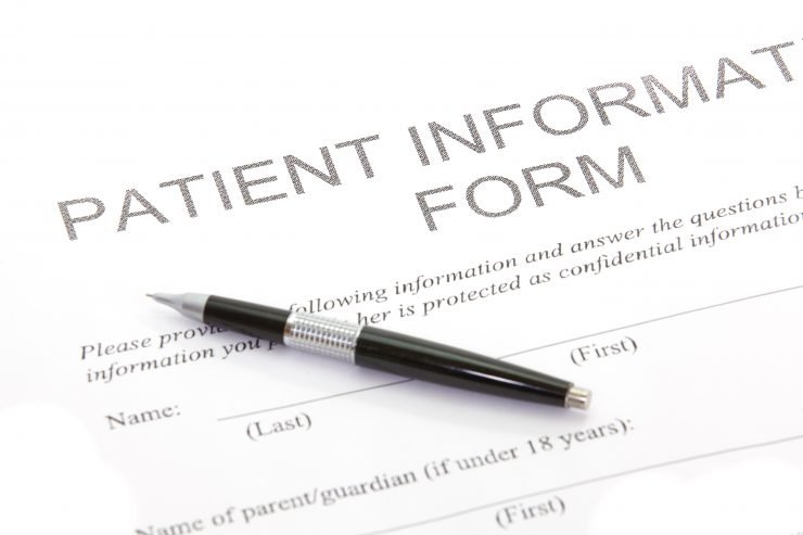 A Patient Form is displayed with a ball point pen on top